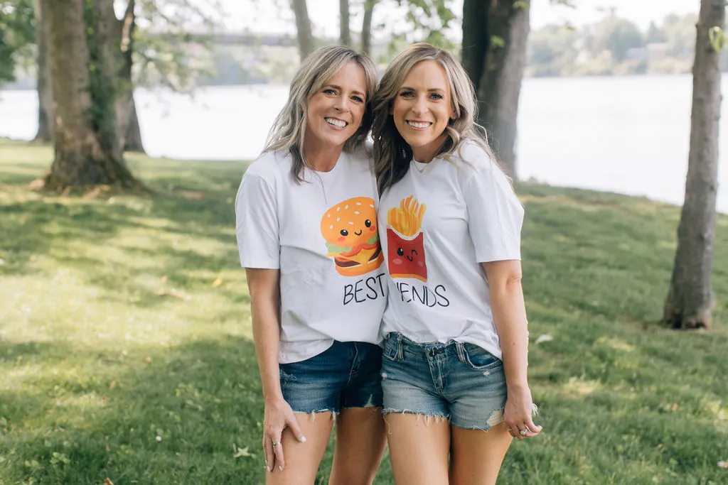 Kim and Kalee in matching shirts at the park.